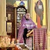Photo of Fr. Kirill standing at a lecturn in front of the Royal Doors and delivering a sermon. In the moment captured, his hands are resting on the lecturn, and he's looking out towards the congregation as he speaks.